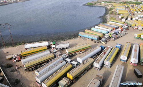 Oil tankers used to transport fuel to NATO forces in Afghanistan are seen at NATO supply terminal in southern Pakistani port city of Karachi, on July 3, 2012. Pakistan on Tuesday night announced that it is reopening land routes for NATO forces in neighboring Afghanistan after US Secretary of State, Hillary Clinton, apologized over the killing of 24 Pakistani soldiers in last November air strike, the country's Information Minister, Qamar-uz-Zaman Kaira said. Photo: Xinhua 