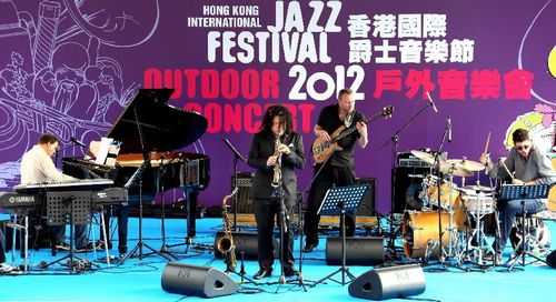 Chinese saxophone player Li Gaoyang (2nd, L) performs with American keyboard player Jim Schneider (L), Australian drummer Cameron Reid (R) and Swedish bass player Peter Scherr at the outdoor concert of 2012 Hong Kong International Jazz Festival in Hong Kong, South China, October 7, 2012. Musicians from over 10 countries and regions gathered and performed in the festival from October 7 to October 12. Photo: Xinhua