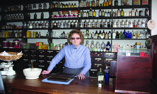 A costumed pharmacist demonstrates how to make pills in the Black Country Living Museum. Photo: Sun Wei