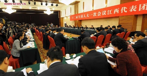 Deputies to the 12th National People's Congress (NPC) from east China's Jiangxi Province take part in a panel discussion in Beijing, capital of China, March 5, 2013. A panel discussion of the Jiangxi delegation to the first session of the 12th NPC was open to media on Tuesday. (Xinhua/Yang Zongyou)