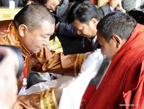 The awarding ceremony for Gexe Lharampa, the highest academic degree in Tibetan Buddhism studies, is held at the Jokhang Temple in Lhasa, capital of southwest China's Tibet Autonomous Region, April 5, 2013. Eight laureates of Gexe Lharampa were awarded here on Friday after they passed tests and defended their dissertations. Gexe means knowledgeable and Lharampa is the highest among the four ranks in the Gexe system. (Xinhua/Chogo)&nbsp; 