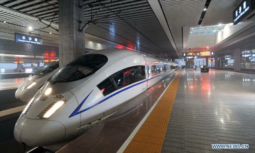 High-speed train G502 leaves the Changsha South Railway Station in Changsha, capital of central China's Hunan Province, Dec. 26, 2012. The Changsha South Railway Station is one of the stops of the 2,298-kilometer Beijing-Guangzhou High-speed Railway, the world's longest, which was put into operation on Wednesday. Running at an average speed of 300 kilometers per hour, the high-speed railway will cut the travel time to about 8 hours from the current 20-odd hours by traditional lines between the country's capital and capital of south China's Guangdong Province. Photo: Xinhua 