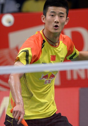 Chen Long of China hits a return against Indonesia's Tommy Sugiarto during their men's singles badminton match at the Indonesia Open in Jakarta on Wednesday. Sugiarto defeated Chen 21-11, 21-18. Photo: AFP