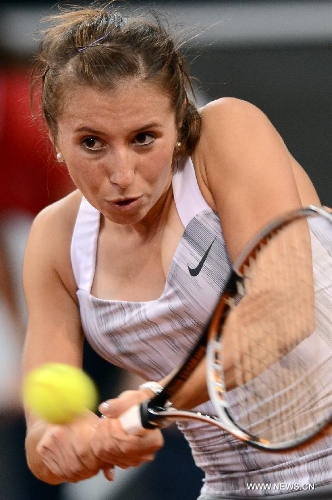 Annika Beck of Germany returns the ball during the first round match of Porsche Tennis Grand Prix against Petra Kvitova of the Czech Republic in Stuttgart, Germany, on April 24, 2013. Beck lost the match 1-2. (Xinhua/Ma Ning) 