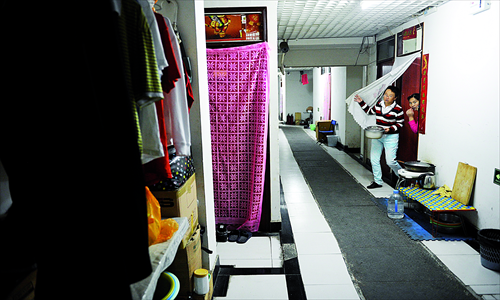 Two tenants live in a basement rented at a residential compound in Guangqumen, Dongcheng district. Photo: Li Hao/GT