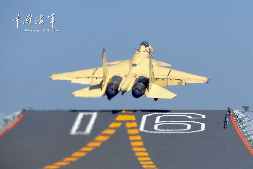 Photo shows a J-15, China's first-generation multi-purpose carrier-borne fighter jet, taking off from the deck of the Liaoning, China's first aircraft carrier, on June 29, 2013. (Source: people.com.cn)Related:China's carrier-borne jet pilots receive certificationBEIJING, July 3 (Xinhua) -- China's first group of five pilots and landing signal officers received their certifications in the latest sea trials of the Liaoning, the country's first aircraft carrier.The Liaoning finished its 25-day test and training mission on Wednesday and returned to a navy port in the east China city of Qingdao. During the training, pilots executed several continuous take-off and landing exercises, making China one of the few countries in the world that can train its own carrier-borne jet pilots.  Full story