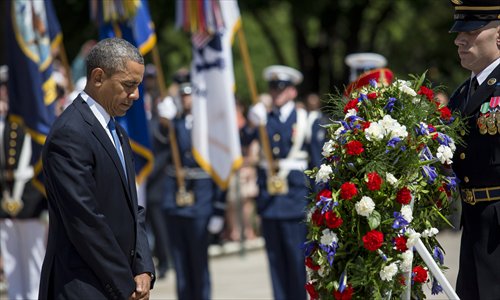 US President Barack Obama lays a wreath at the Tomb of the Unknown Soldier in honor of Memorial Day at Arlington National Cemetery, on Monday in Arlington, Virginia. Photo: AFP