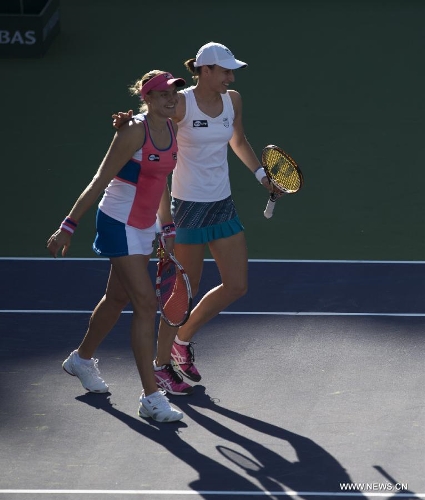 Nadia Petrova (L) of Russia and Katarina Srebotnik of Slovenia celebrate after winning their women's doubles semifinal match against Hsieh Su-Wei of Chinese Taipei and Peng Shuai of China during the BNP Paribas Open in Indian Wells, California, March 14, 2013. Petrova and Srebotnik won 2-0 to enter the final. (Xinhua/Yang Lei) 