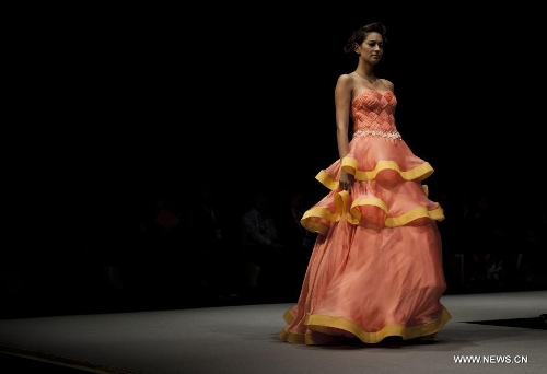 A model presents a creation of Indonesian brand Jeanny Ang Couture's 2013 spring/summer series at the 11th 