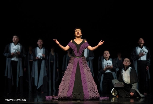 Actress Jiang Shan (C) performs during the stage drama 