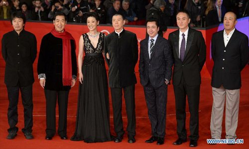 Chinese director Feng Xiaogang (C), actress Xu Fan (3rd L) and actor Zhang Guoli (2nd L) pose on the red carpet of the 7th Rome Film Festival in Rome, Italy, Nov. 9, 2012. The 7th Rome Film Festival opened late Friday. Feng's 