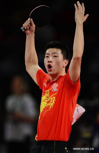 Ma Long of China celebrates during men's singles round of 16 against Niwa Koki of Japan at the 2013 World Table Tennis Championships in Paris, France on May 18, 2013. Ma won 4-2. (Xinhua/Tao Xiyi) 