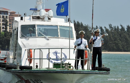 Staff members are on duty monitoring water areas around Boao, south China's Hainan Province, April 3, 2013. A fleet of five marine surveillance ships will monitor maritime traffic safety, investigate maritime accidents, detect pollution, and carry out other missions around the clock during the Boao Forum for Asia Annual Conference 2013 in Hainan. (Xinhua/Shi Manke)  