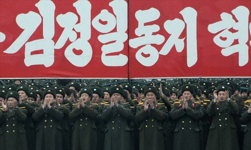 Military officers and soldiers attend a celebration for the successful launch of the Kwangmyongsong-3 satellite in Pyongyang, capital of the Democratic People's Republic of Korea (DPRK), on Dec. 14, 2012. According to the DPRK's official media KCNA, a Unha-3 rocket carrying the second version of the Kwangmyongsong-3 satellite blasted off from the Sohae Space Center in Cholsan County, North Phyongan Province, on Dec. 12.  Photo: Xinhua