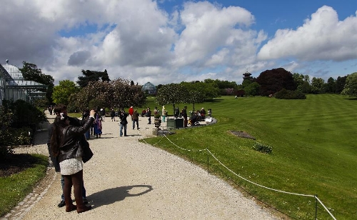 Residents and tourists visit the Royal Greenhouse of Laeken in the royal garden in Brussels, capital of Belgium, May 10, 2013. The Belgian royal family opens its greenhouses in the royal garden with wide variety of flowers to the public for three weeks every year. (Xinhua/Zhou Lei) 