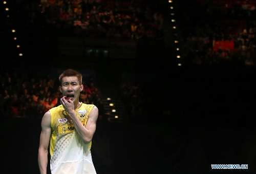 Malaysia's Lee Chong Wei reacts during his men's singles final match against China's Chen Long at the 2013 Yonex All England Open Badminton Championships, in Birmingham, Britain, March 10, 2013. Chen Long won 2-0 to claim the titel.(Xinhua/Yin Gang)