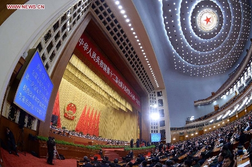  The fourth plenary meeting of the first session of the 12th National People's Congress (NPC) is held at the Great Hall of the People in Beijing, capital of China, March 14, 2013. Chairman, vice-chairpersons, secretary-general and members of the 12th NPC Standing Committee, president and vice-president of the state, and chairman of the Central Military Commission of the People's Republic of China will be elected here on Thursday. (Xinhua/Li Tao)
