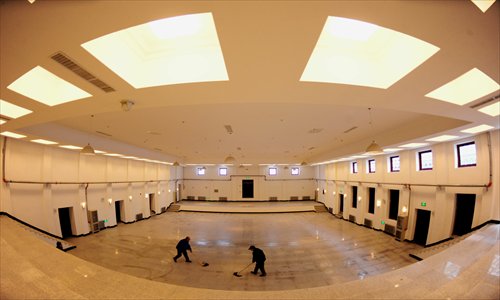 Workers are seen on Thursday mopping the floor of the old military court in Shenyang, Northeast China's Liaoning Province where Japanese war criminals were tried after World War II ended. Restoration work on the military court has just been completed and the site is scheduled to open to visitors next year. Photo: CFP