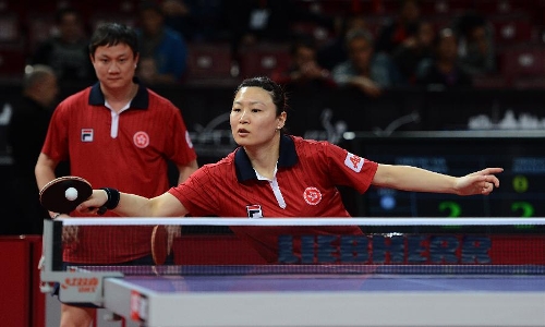 Jiang Huajun (R) and Cheung Yuk of Hong Kong of China compete during the first round of mixed doubles against Michal Obeslo and Hana Matelova of the Czech Republic at Palais omnisport de Paris Bercy in Paris, France, on May 14, 2013. Jiang and Cheung won 4-0. (Xinhua/Tao Xiyi) 
