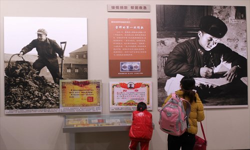 Visitors look at the Forever Lei Feng exhibition at the China Millennium Monument on Friday. From March 4, about 23,000 visitors watched the exhibition over five days. Photo: CFP