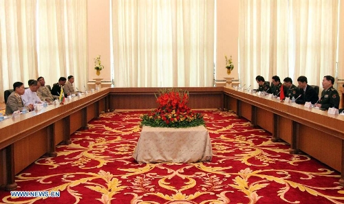 Representatives from China and Myanmar hold a meeting in Nay Pyi Taw, capital of Myanmar, on Jan. 20, 2013. Deputy Chief of General Staff of the Chinese People 's Liberation Army Qi jianguo arrived here Saturday for the first China-Myanmar strategic security consultation. (Xinhua/U Aung)