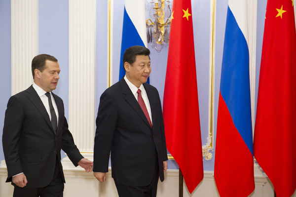 Chinese President Xi Jinping (R) meets with Russia's Prime Minister Dmitry Medvedev in Moscow, capital of Russia, March 23, 2013. Photo: Xinhua