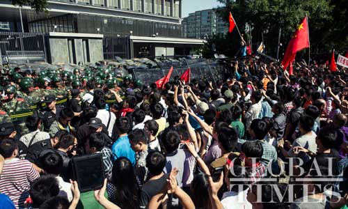Chinese people rallies in front of Japan embassy in Beijing on Saturday to protest Japan's so-called 