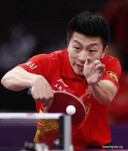 Ma Long of China competes during men's singles round of 16 against Niwa Koki of Japan at the 2013 World Table Tennis Championships in Paris, France on May 18, 2013. Ma won 4-2. (Xinhua/Wang Lili) 