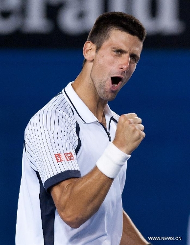 Novak Djokovic of Serbia reacts after winning his men's singles quarterfinals match against Tomas Berdych of Czech Republic at 2013 Australian Open tennis tournament in Melbourne, Australia, Jan. 22, 2013. Novak Djokovic won 3-1. (Xinhua/Bai Xue) 