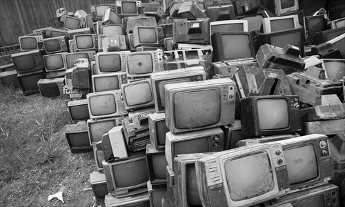 Around 80,000 old televisions are piled up in a yard in the Tianyuan district of Zhuzhou, Hunan Province, on Monday. The imported and domestic sets from the 1970s to 1990s are expected to be recycled. Photo: CFP