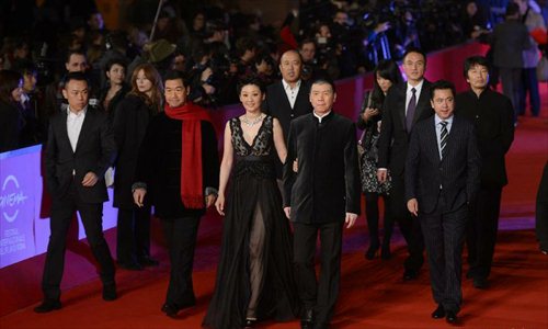 Chinese producer Wang Zhonglei, director Feng Xiaogang, actress Xu Fan and actor Zhang Guoli (R-L) walk on the red carpet of the 7th Rome Film Festival in Rome, Italy, Nov. 9, 2012. The 7th Rome Film Festival opened late Friday. Feng's 