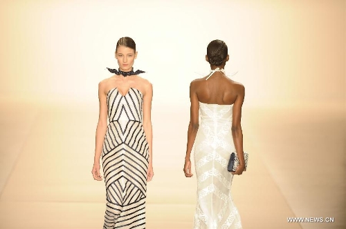 Models present creations of Acquastudio during Sao Paulo Fashion Week in Sao Paulo, Brazil, March 19, 2013. The Sao Paulo Fashion Week Summer 2013/14 started here on Monday and will last for five days. (Xinhua/Weng Xinyang) 