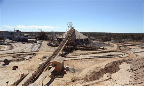 Stockpiles of ore sit under a shelter at the Norton Gold Fields Ltd Paddington mine, 35 kilometers northwest of Kalgoorlie, Australia. Norton, the Australian producer controlled by China's Zijin Mining Group Co, is seeking further acquisition targets as falling prices cut the value of mines. Photo: CFP