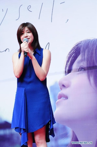 Actress Michelle Chen performs during a signing promotion event for her new album 