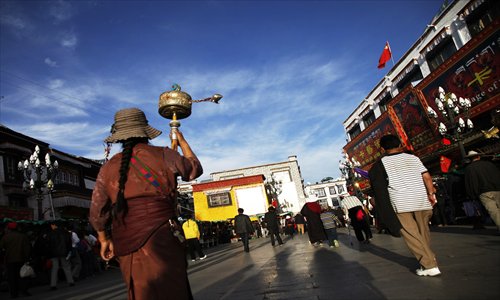 A Tibetan woman walks near Jokhang Temple in Lhasa. The temple is closely related to Princess Wencheng of the Tang Dynasty (618-907). Photo: CFP