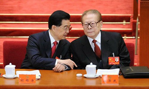 Hu Jintao (L), general secretary of the Central Committee of the Communist Party of China (CPC) and Chinese president, talks with Jiang Zemin, former general secretary of the CPC Central Committee and former Chinese president, during the opening ceremony of 18th CPC National Congress at the Great Hall of the People in Beijing, capital of China, Nov. 8, 2012. The 18th CPC National Congress opened in Beijing on Thursday. Photo: Xinhua
