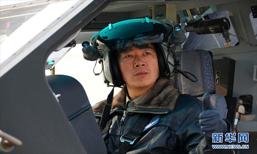 Cheng Jianzhong, chief of staff of an army aviation brigade under the Nanjing Military Area Command (MAC) of the Chinese People's Liberation Army (PLA), is China's first batch of super-level pilots of WZ-10, first batch of all-weather pilots of WZ-10, and also the first batch of pilots who completed the fire test with WZ-10's all kinds of weapon systems. (Xinhua/Guo Weihu)

