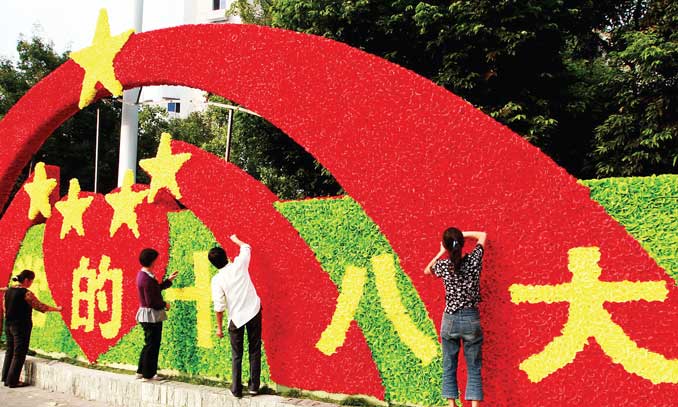 Gardeners decorate flowerbeds in Suining, Southwest China's Sichuan Province on Friday to greet the upcoming 18th National Congress of the Communist Party of China, which will be held on November 8 in Beijing. Photo: CFP