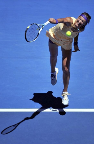 Victoria Azarenka of Belarus serves the ball during her first round women's singles match against Monica Niculescu of Romania on the second day of 2013 Australian Open tennis tournament in Melbourne, Australia, Jan. 15, 2013. Victoria Azarenka won 2-0 to enter the next round. (Xinhua/Chen Xiaowei) 