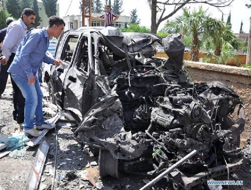 Photo taken on May 11, 2013 shows the site of an explosion in the town of Reyhanli, in the southern Turkish province of Hatay. At least 40 people were killed and 100 others injured after explosions shook a Turkish town on Saturday near the border with Syria, Turkish Interior Minister Muammer Guler said. (Xinhua/NTV) 