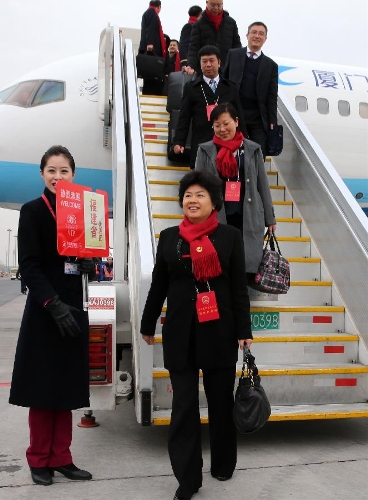 Deputies to the 12th National People's Congress (NPC) from southeast China's Fujian Province arrive in Beijing, capital of China, March 2, 2013. The first session of the 12th NPC is scheduled to open in Beijing on March 5. (Xinhua/Pang Xinglei) 