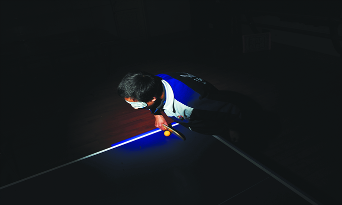 Xiao Chao, 15, from Changsha Special Education School, practises table tennis for vision-impaired people.