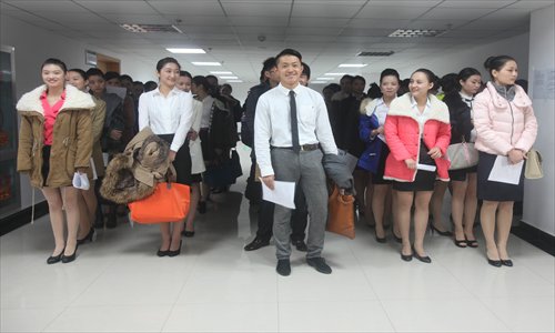Job applicants wait to interview for positions as flight attendants with China Southern Airlines Wednesday in Wuhan, Hubei Province. In recent weeks, several domestic airlines have started campaigns to recruit new cabin crew members. Photo: CFP