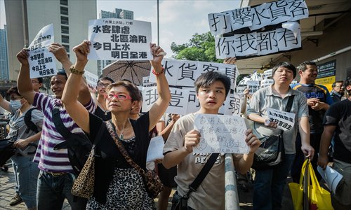 Hongkongers protest against mainland parallel traders who cross the Shenzhen-Hong Kong border every day to buy products to resell at a profit on October 23. Photo: AFP