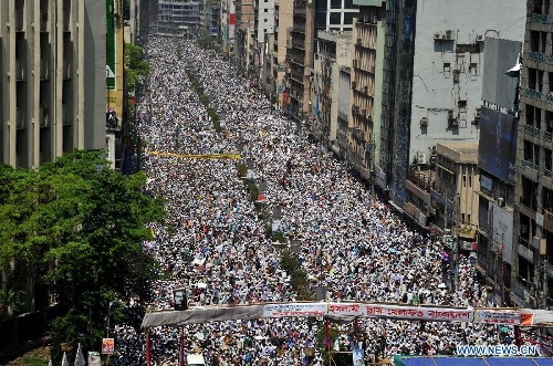 Bangladeshi Muslim activists attend a grand rally at Motijheel area in Dhaka, Bangladesh, April 6, 2013. Tens of thousands of Islamists under the banner of Hefazat-e-Islam from across Bangladesh poured into the key commercial hub of the capital city to join a grand rally, demanding action against the 