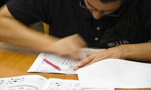 A competitor erases a bad guess during the 6th World Sudoku Championship held last year in Eger, Hungary. Photo: CFP