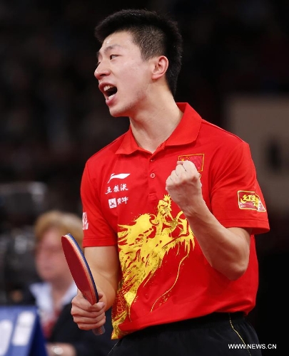 Ma Long of China celebrates during men's singles round of 16 against Niwa Koki of Japan at the 2013 World Table Tennis Championships in Paris, France on May 18, 2013. Ma won 4-2. (Xinhua/Wang Lili) 