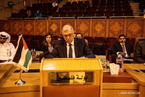 Palestinian permanent delegate Barakat Al-Farra is seen during the Arab League (AL) emergency meeting at the level of permanent delegates to discuss the latest Israeli assaults on Al-Aqsa mosque, one of the three most sacred mosques for Muslims, at the AL headquarters in Cairo, May 12, 2013. (Xinhua/Amru Salahuddien) 
