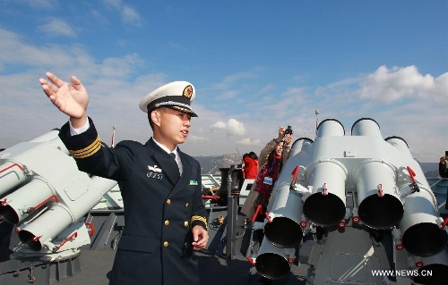 A soldier introduces to visitors on the frigate Huangshan of the 13th naval escort squad sent by the Chinese People's Liberation Army (PLA) Navy at the Toulon harbour in France, April 23, 2013. The 13th convoy fleet including the frigates Huangshan and Hengyang and the supply ship Qinghaihu arrive in Toulon, France on Tuesday, beginning a five-day visit to the country. (Xinhua/Gao Jing) 