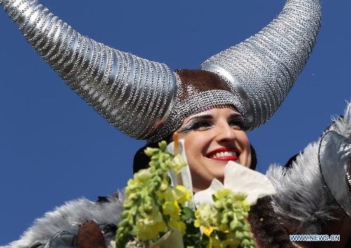 A performer takes part in the flowers parade during the 129th annual Nice Carnival parade, in Nice, southern France, March 2, 2013. (Xinhua/Gao Jing)